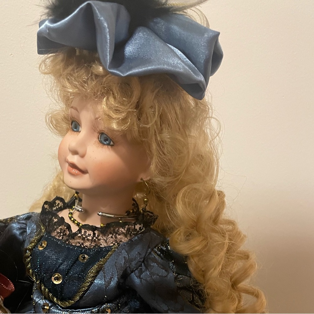Elegant Blue and Gold Porcelain Doll